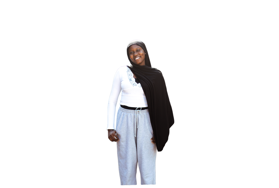 Coumba Aw standing confidently in Sédhiou, Senegal
